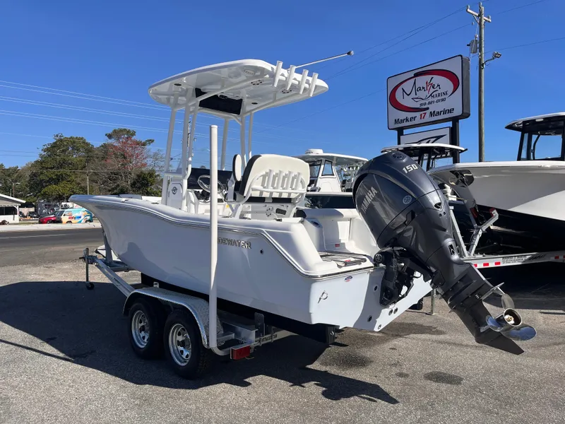Slide: The Image of 2025 Tidewater 210 CC Adventure boat on trailer with Yamaha outboard motor. - 2