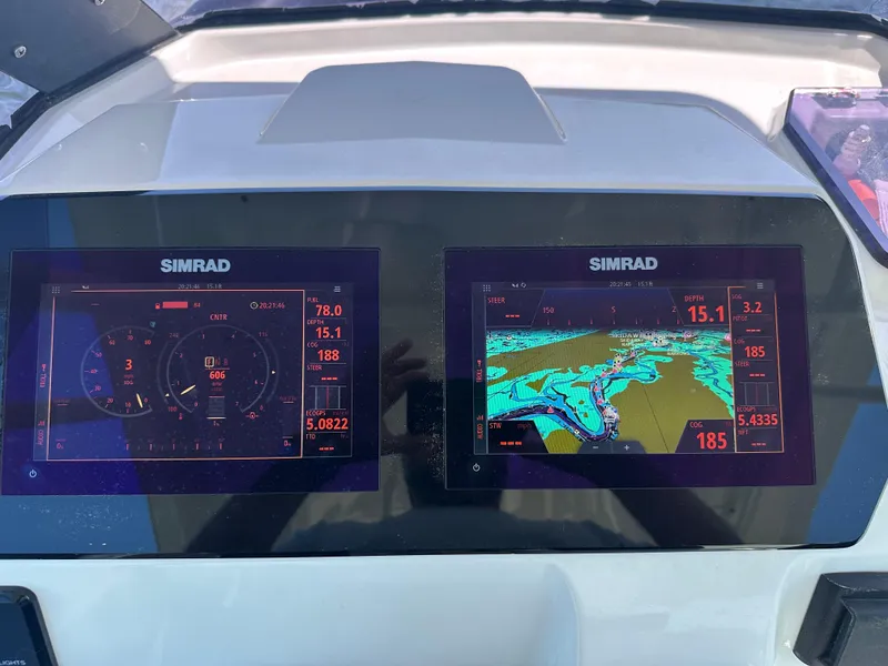 Slide: The Image of Simrad navigation displays on 2021 Brig Eagle 8 boat dashboard. - 10