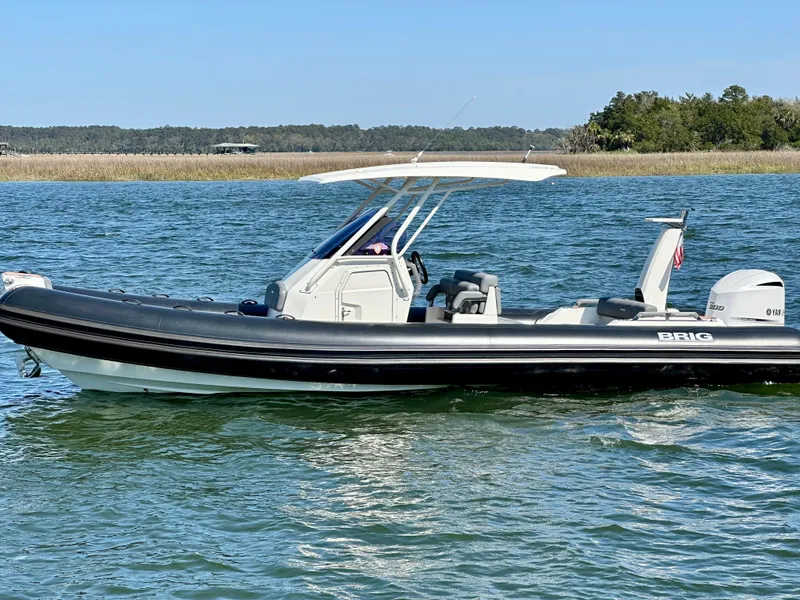 Slide: The Image of 2021 Brig Eagle 8 boat cruising on a sunny day in open water. - 2