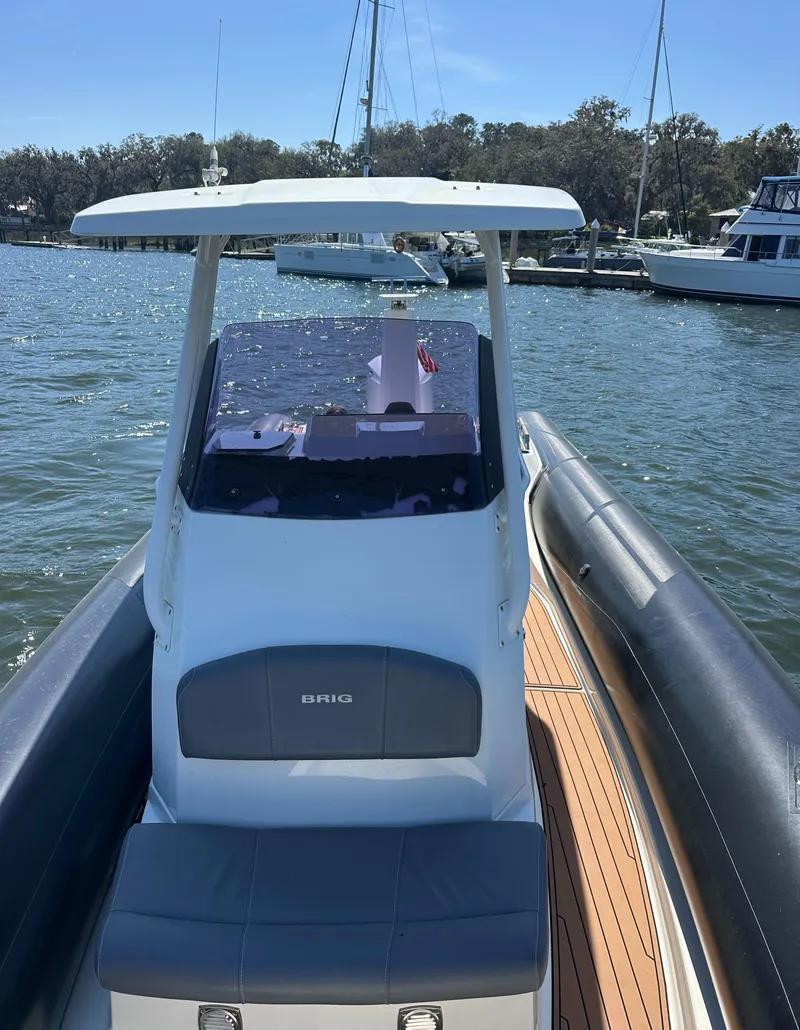 Slide: The Image of 2021 Brig Eagle 8 boat on water, featuring sleek design and modern console. - 6