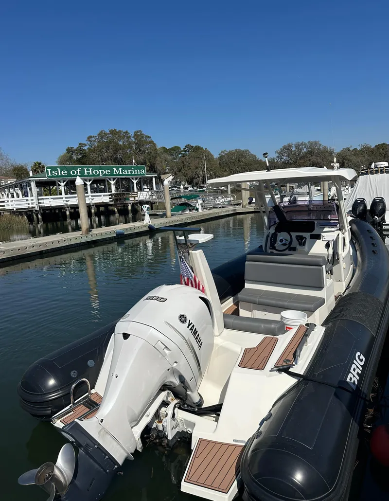 Slide: The Image of 2021 Brig Eagle 8 boat docked at Isle of Hope Marina, featuring Yamaha engine. - 8
