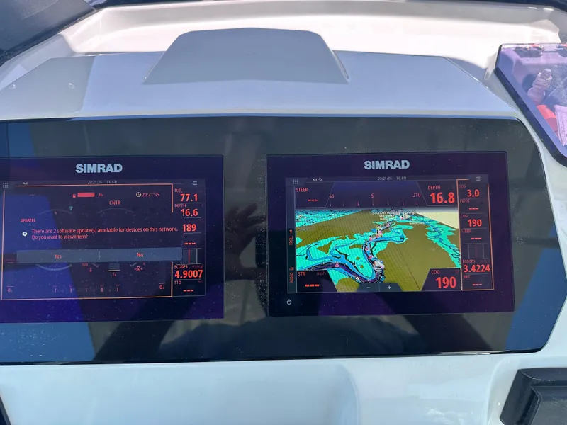 Slide: The Image of Simrad navigation screens on a 2021 Brig Eagle 8 boat dashboard. - 9