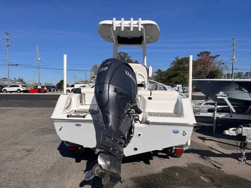 Slide: The Image of 2025 Tidewater 210 LXF boat with Yamaha outboard motor, parked outdoors. - 3