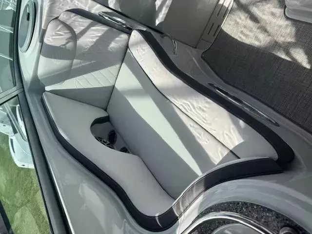 Slide: The Image of 2024 Crownline 270 CR boat interior with sleek seating and modern design. - 16