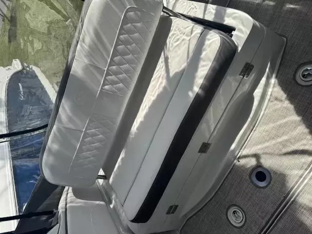 Slide: The Image of 2024 Crownline 270 CR boat interior with white cushioned seating and elegant design. - 21