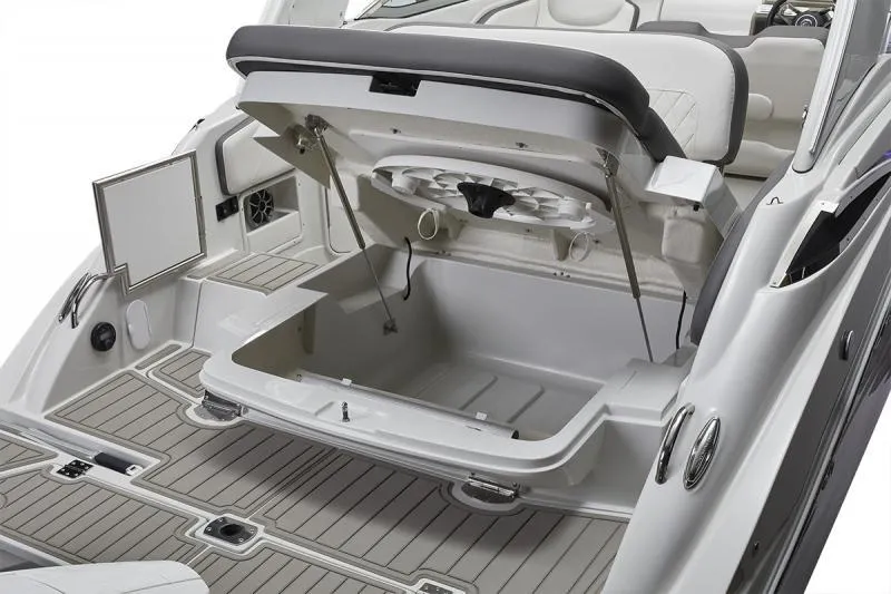 Slide: The Image of 2024 Crownline 280 CRX boat with open storage compartment and sleek interior design. - 9