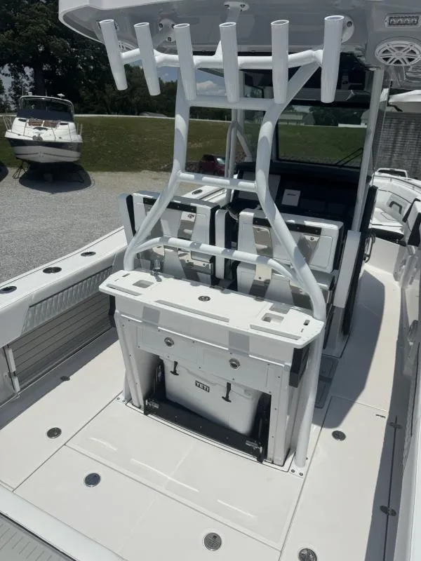 Slide: The Image of 2025 Blackfin 272 CC boat interior with rod holders and seating. - 17