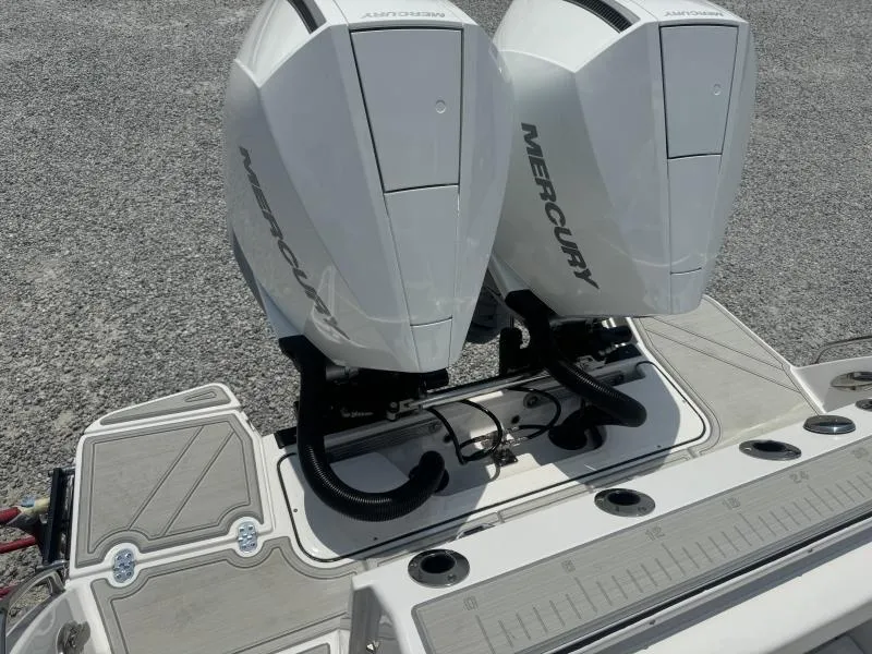 Slide: The Image of 2025 Blackfin 272 CC boat with dual Mercury outboard engines. - 6