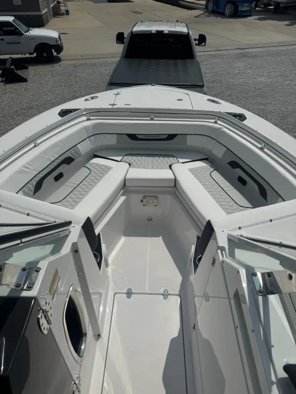 Slide: The Image of 2025 Blackfin 252 DC boat interior with spacious seating and modern design. - 21