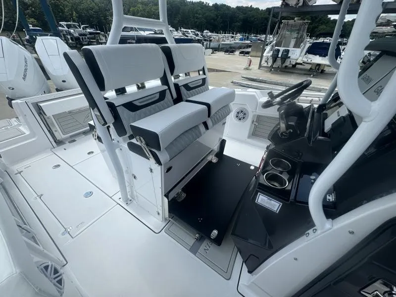 Slide: The Image of 2025 Blackfin 302 CC boat interior with dual seats and steering console. - 13