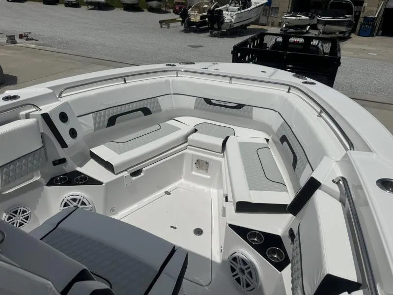 Slide: The Image of 2025 Blackfin 302 CC boat interior with white seating and modern design. - 15