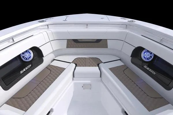 Slide: The Image of 2025 Blackfin 302 DC boat interior with sleek seating and modern audio system. - 16