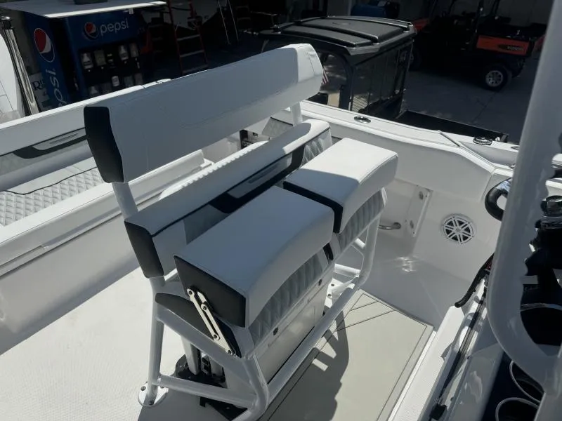 Slide: The Image of 2025 Blackfin 222 CC boat interior with white seating and modern design. - 11