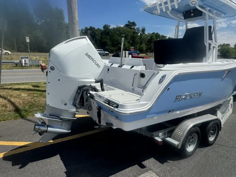 Slide: The Image of 2025 Blackfin 222 CC boat on trailer with Mercury outboard engine. - 3
