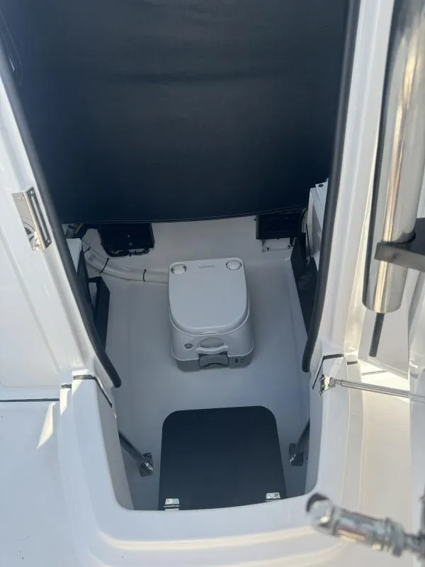 Slide: The Image of 2025 Blackfin 222 CC boat interior with compact marine toilet. - 6