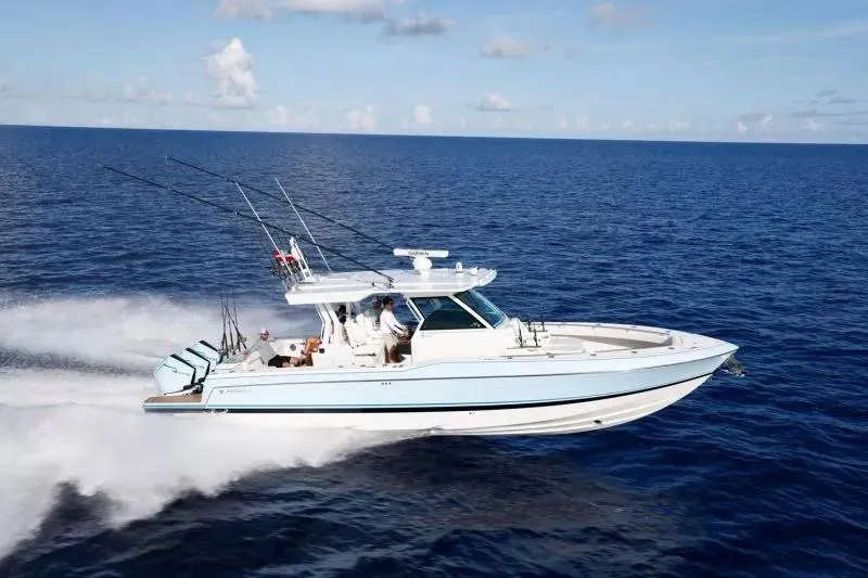 Slide: The Image of 2023 Formula 387 Center Console Fish boat cruising on open ocean. - 1