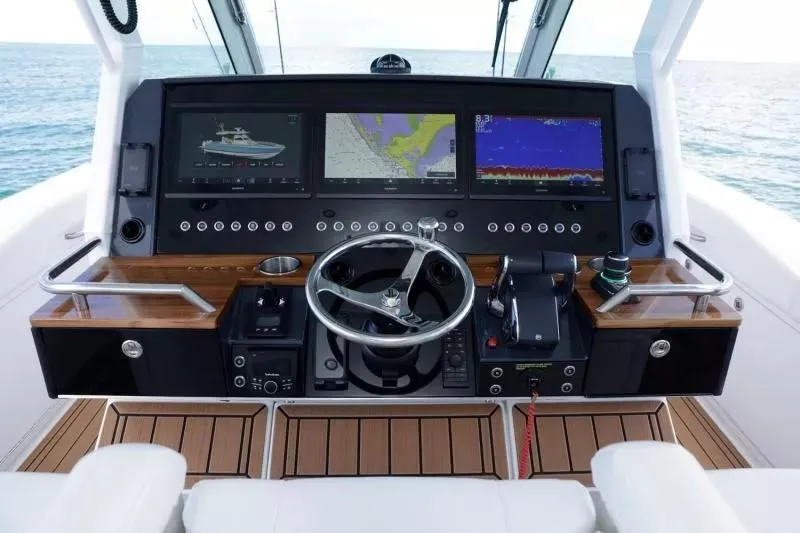 Slide: The Image of 2023 Formula 387 Center Console Fish dashboard with advanced navigation displays and controls. - 17