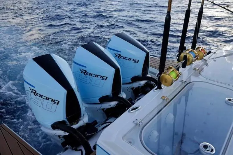 Slide: The Image of 2023 Formula 387 Center Console Fish with triple racing engines on open water. - 20