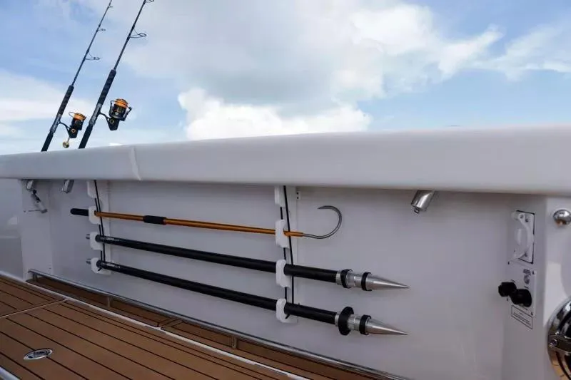 Slide: The Image of 2023 Formula 387 Center Console Fish with fishing rods and gaffs on deck. - 5