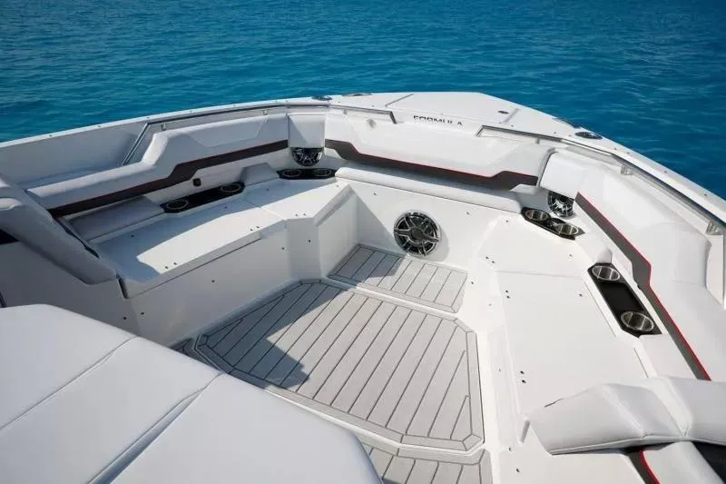 Slide: The Image of 2023 Formula 387 Center Console Sport boat interior with seating and cup holders. - 5