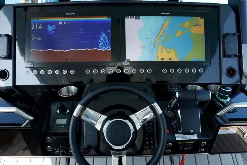 Slide: The Image of 2023 Formula 387 Center Console Sport dashboard with navigation and sonar displays. - 7