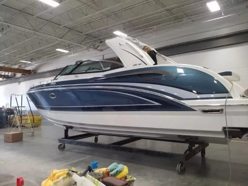 Slide: The Image of 2021 Formula 350 Crossover Bowrider in a showroom, showcasing sleek design and modern features. - 1