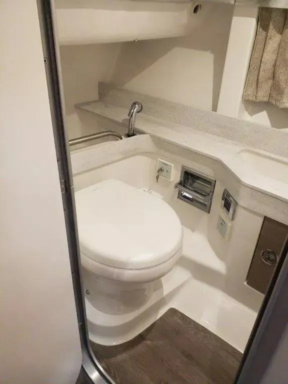 Slide: The Image of 2021 Formula 350 Crossover Bowrider bathroom with modern fixtures and compact design. - 11