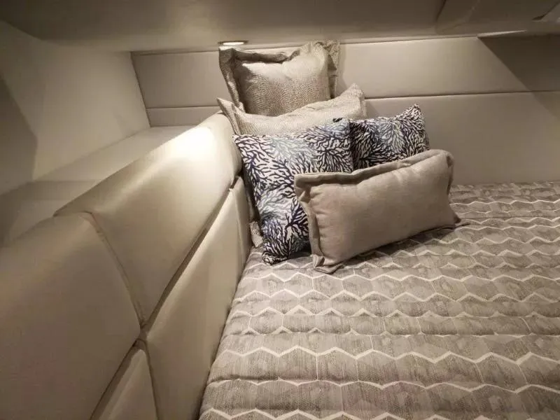 Slide: The Image of Luxurious cabin interior of 2021 Formula 350 Crossover Bowrider with plush bedding and pillows. - 14