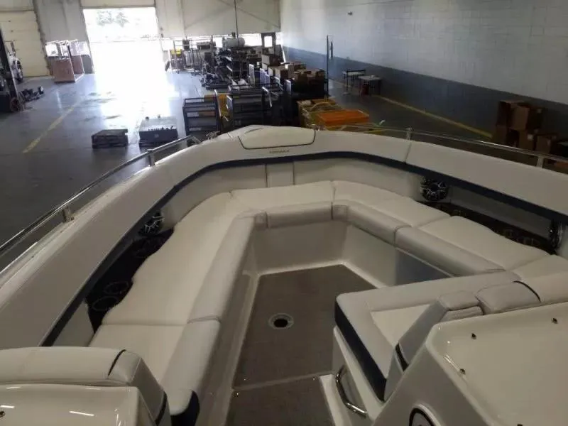 Slide: The Image of 2021 Formula 350 Crossover Bowrider interior with spacious seating in a warehouse setting. - 15