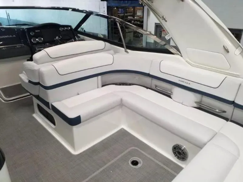 Slide: The Image of 2021 Formula 350 Crossover Bowrider interior with white seating and modern dashboard. - 21
