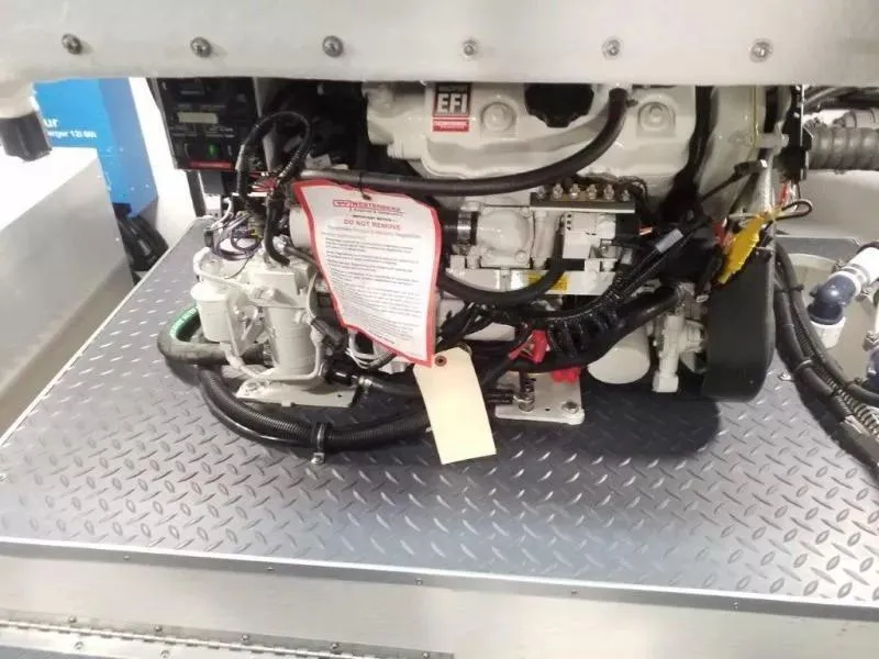 Slide: The Image of Engine compartment of a 2021 Formula 350 Crossover Bowrider on diamond plate flooring. - 8