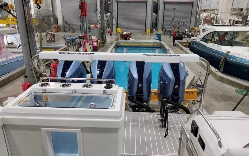 Slide: The Image of 2024 Formula 430 All Sport Crossover in a boat manufacturing facility. - 10