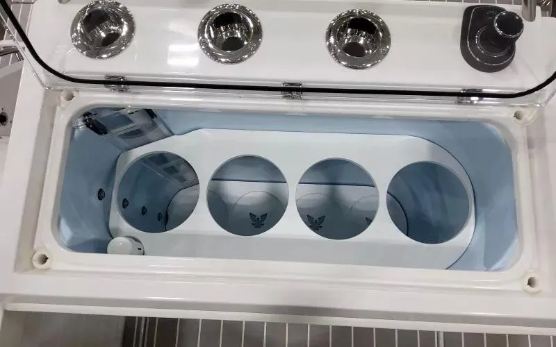 Slide: The Image of 2024 Formula 430 All Sport Crossover boat cooler compartment with cup holders and sleek design. - 11