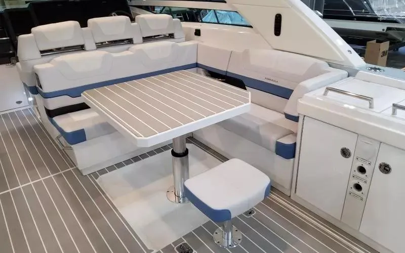 Slide: The Image of 2024 Formula 430 All Sport Crossover boat interior with seating and table. - 15