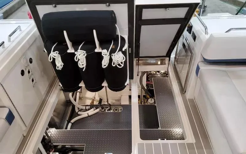 Slide: The Image of 2024 Formula 430 All Sport Crossover boat interior with storage compartments and equipment. - 18