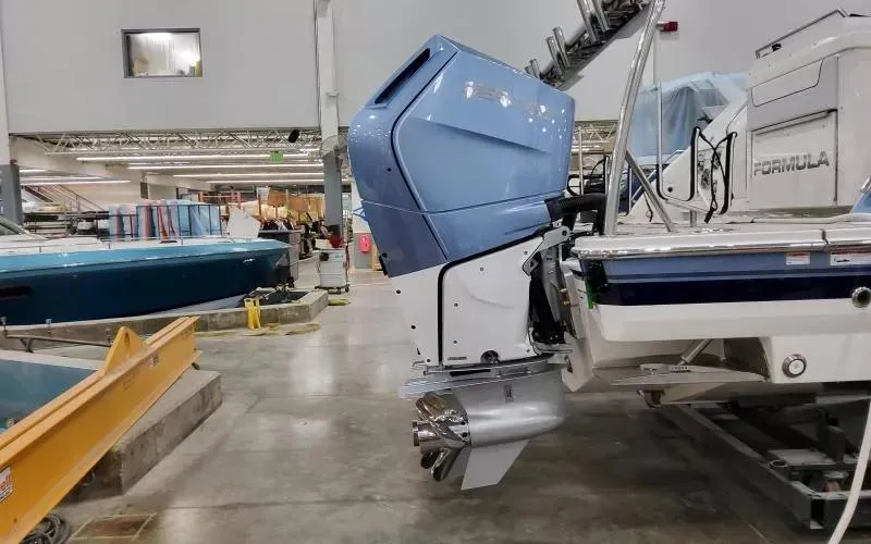 Slide: The Image of 2024 Formula 430 All Sport Crossover boat with powerful outboard motor in a workshop. - 6