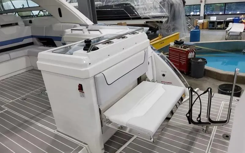 Slide: The Image of 2024 Formula 430 All Sport Crossover boat interior with foldable seat and swim ladder. - 8