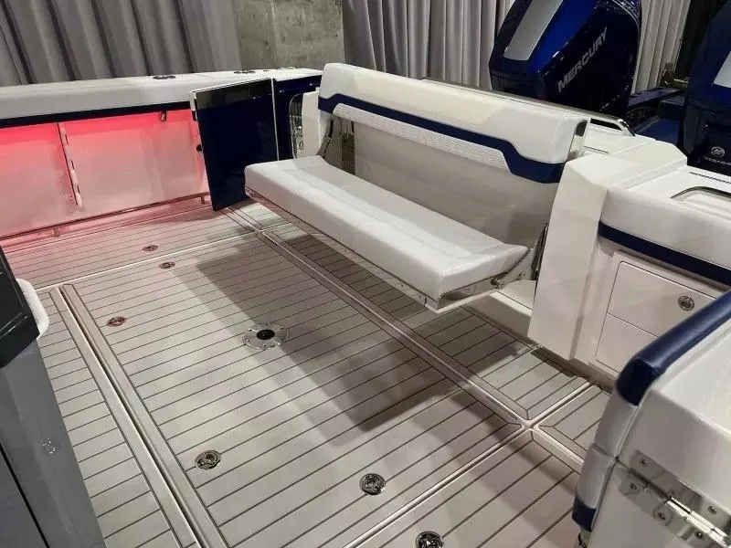 Slide: The Image of 2023 Formula 387 Center Console Sport boat interior with foldable seating and modern design. - 5