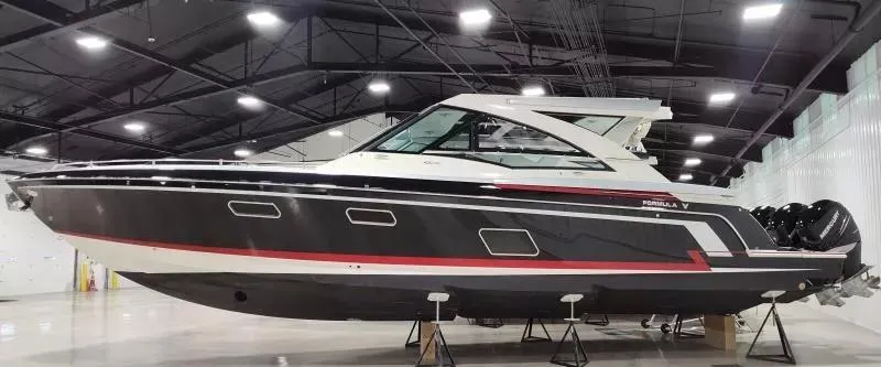 Slide: The Image of 2017 Formula 430 Super Sport Crossover boat in a showroom, side view. - 1