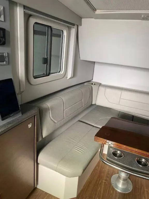 Slide: The Image of Interior of 2017 Formula 430 Super Sport Crossover with modern seating and table. - 10