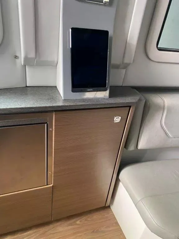 Slide: The Image of Interior of 2017 Formula 430 Super Sport Crossover with modern cabinetry and seating. - 12