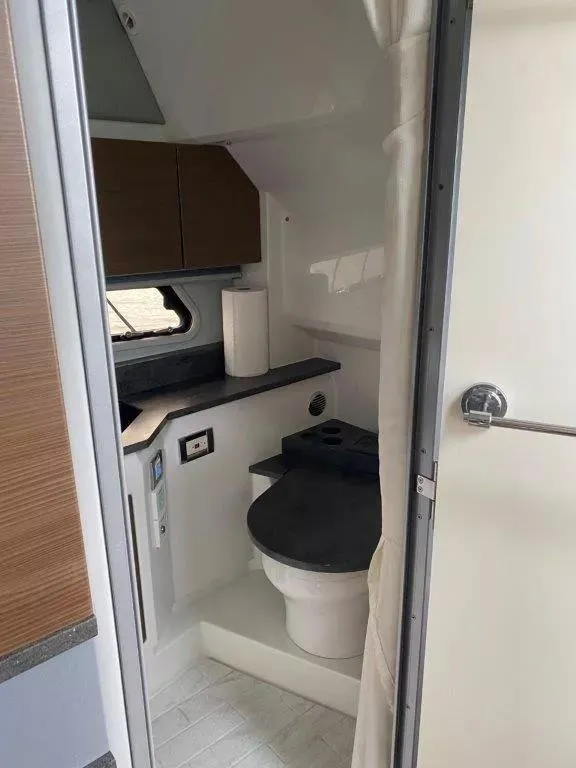 Slide: The Image of 2017 Formula 430 Super Sport Crossover bathroom interior with modern fixtures and compact design. - 14