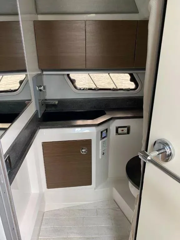 Slide: The Image of Interior of 2017 Formula 430 Super Sport Crossover boat bathroom with modern fixtures. - 15