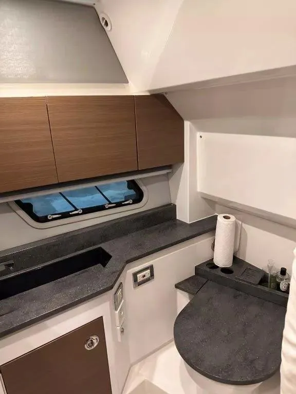 Slide: The Image of Interior of 2017 Formula 430 Super Sport Crossover boat, featuring modern kitchen area. - 18