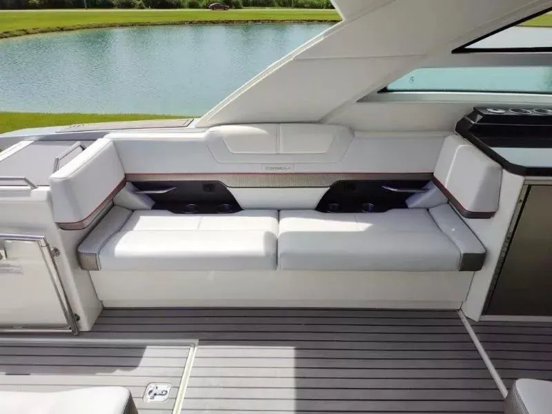Slide: The Image of 2017 Formula 430 Super Sport Crossover boat interior with white seating and sleek design. - 23