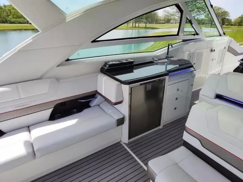 Slide: The Image of Luxurious interior of 2017 Formula 430 Super Sport Crossover yacht with seating and kitchenette. - 24
