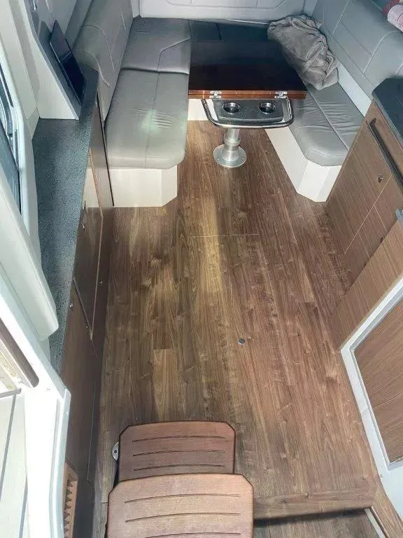 Slide: The Image of Interior of 2017 Formula 430 Super Sport Crossover with wood flooring and seating area. - 8