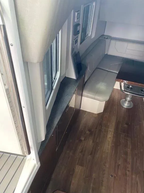 Slide: The Image of Interior of 2017 Formula 430 Super Sport Crossover with seating and table. - 9