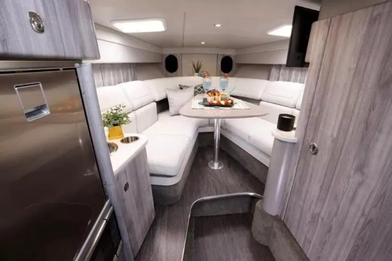 Slide: The Image of Luxurious interior of 2023 Formula 310 Sun Sport boat with modern seating and dining area. - 2
