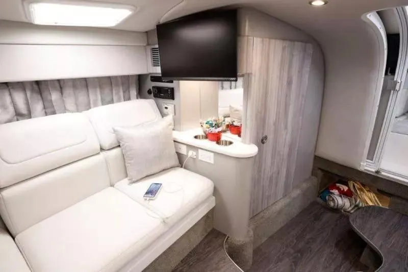 Slide: The Image of Interior of 2023 Formula 310 Sun Sport boat with modern seating and entertainment system. - 5